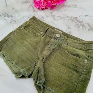 Olive green velvet shorts.